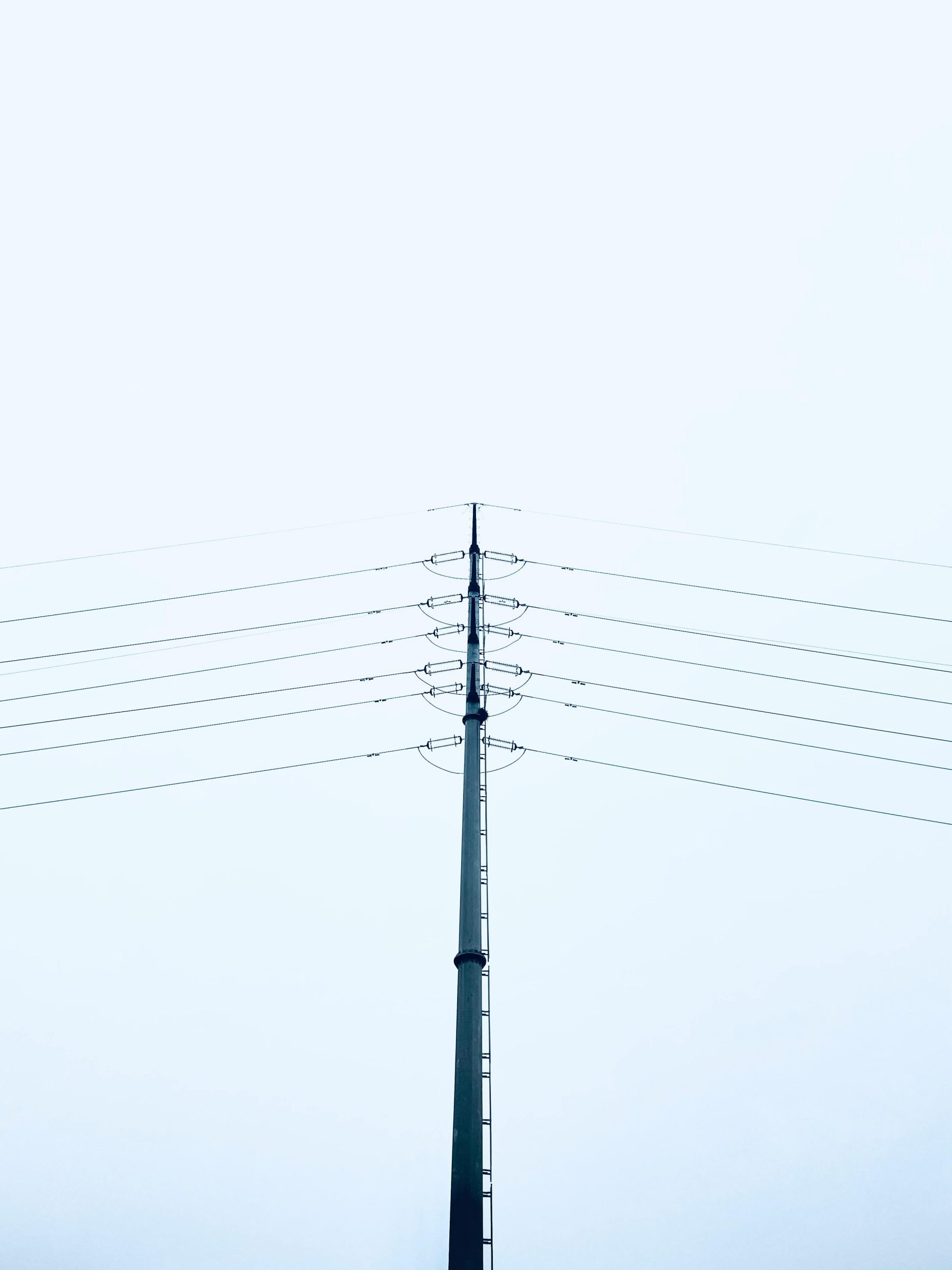 Hyper-realistic photography, a set of pole line hardware including cross-arm braces, bolts, and insulators prepared for assembly, technical overhead shot, hot dip galvanized finish, white background